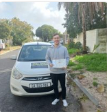 West Coast Driving School learner holding a certificate
